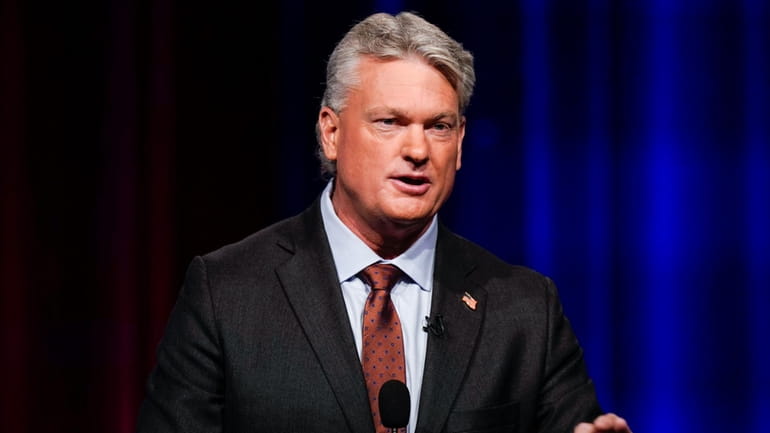 Mike Collins participates in a Republican primary debate for Georgia's...