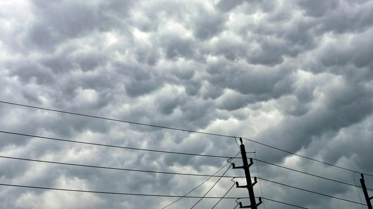 Clouds amass over power lines follow days of storms on...