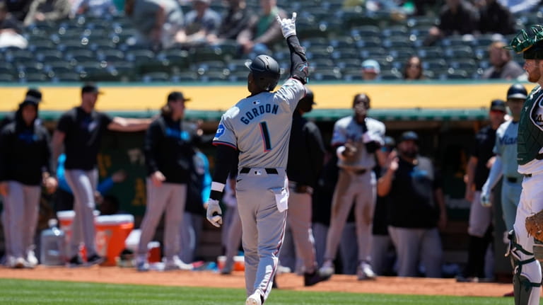 Miami Marlins' Nick Gordon (1) celebrates after hitting a three-run...