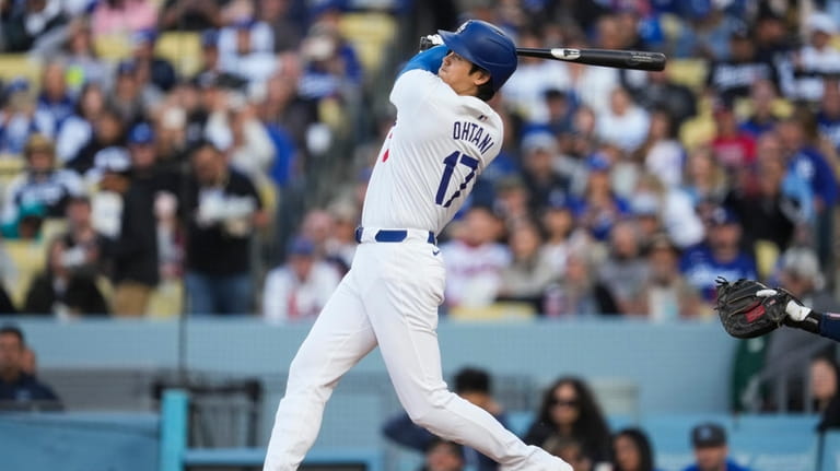 Los Angeles Dodgers designated hitter Shohei Ohtani (17) hits a...
