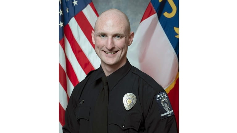 This photo provided by the Charlotte-Mecklenburg Police Department shows officer...