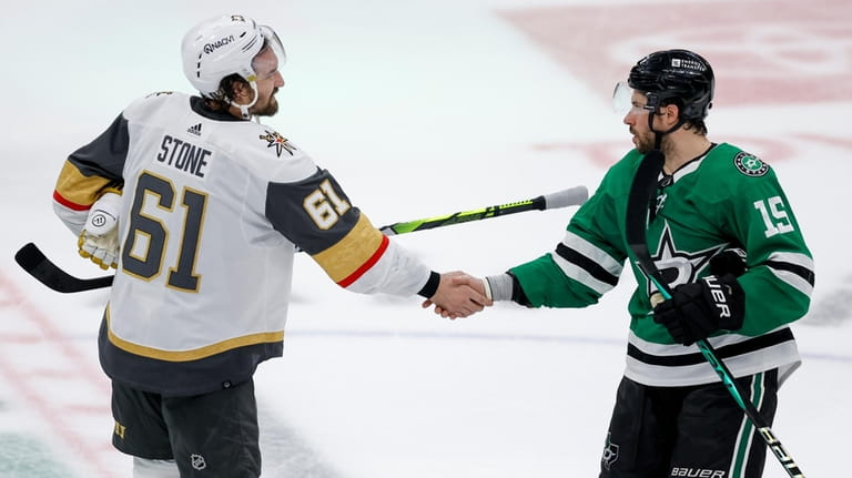Vegas Golden Knights right wing Mark Stone shakes hands with...