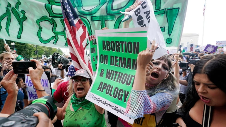 People protest about abortion, Friday, June 24, 2022, outside the...