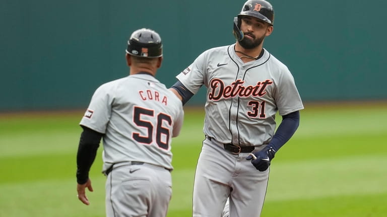 Detroit Tigers' Riley Greene (31) is congratulated by third base...