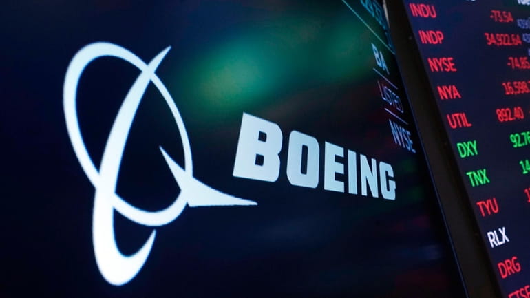 The logo for Boeing appears on a screen above a...