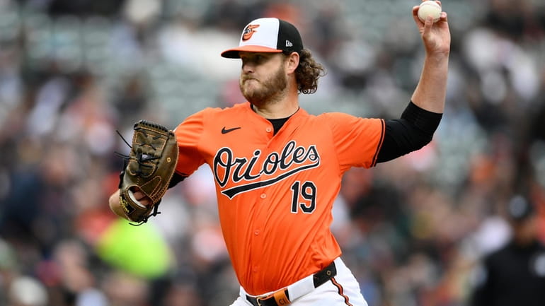 Baltimore Orioles starting pitcher Cole Irvin throws during the second...