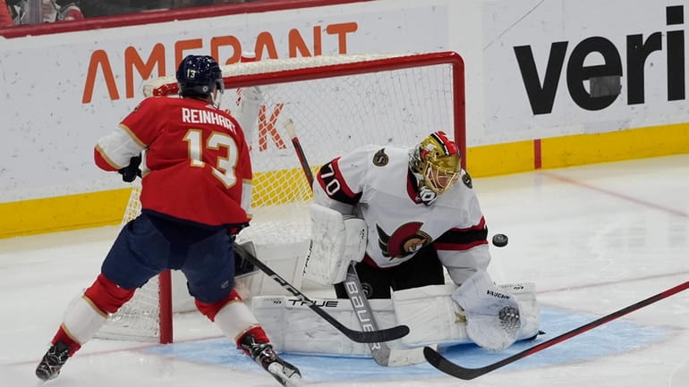 Ottawa Senators goaltender Joonas Korpisalo (70) stops a shot on...