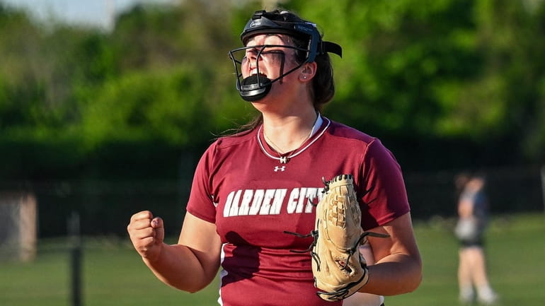 Kaitlyn Santopietro of Garden City reacts after throwing the strike...