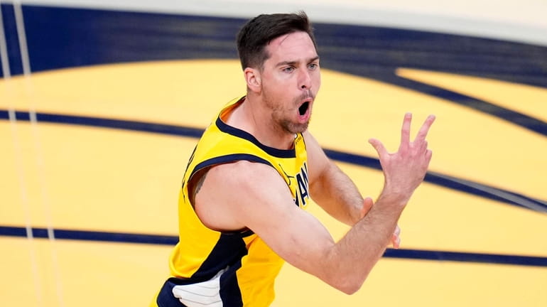 Pacers guard T.J. McConnell celebrates after making a basket during...