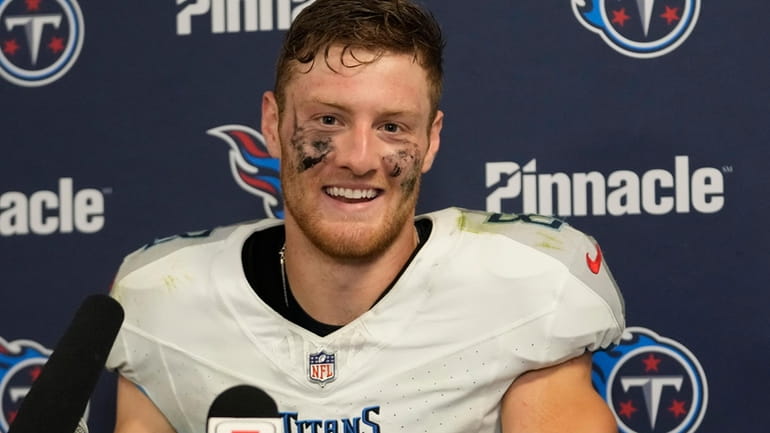Tennessee Titans quarterback Will Levis smiles during a news conference...