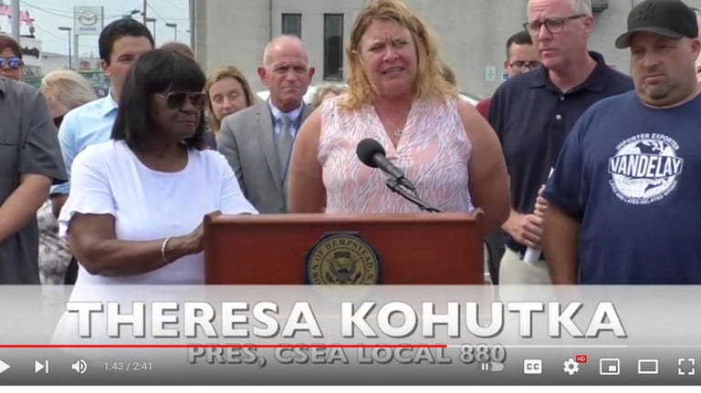 A screenshot of Theresa Kohutka, center, from a Hempstead Town press conference...
