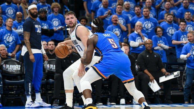 Dallas Mavericks guard Luka Doncic (77) works the floor against...