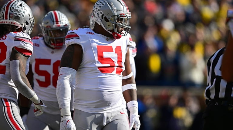 Ohio State defensive tackle Michael Hall Jr. (51) lines up...