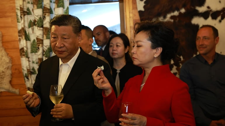 Chinese President Xi Jinping and his wife Peng Liyuan enjoy...