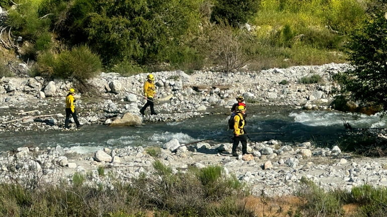 The San Bernardino County Fire Department conduct a swift water...