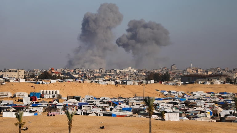 Smoke rises following an Israeli airstrike east of Rafah, Gaza...