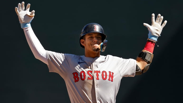 Boston Red Sox's Vaughn Grissom celebrates after his two-run double...