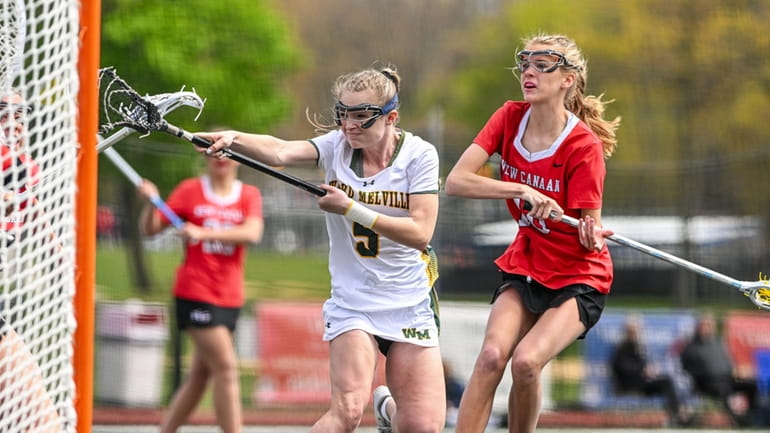 Ava Simonton of Ward Melville puts the shot in the...