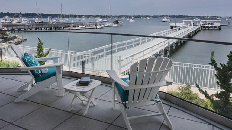 Chairs pointing out toward Manhasset Bay from the deck of...
