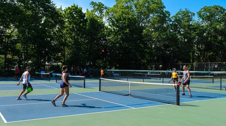 People play pickle ball at Hempstead Lake State Park June...
