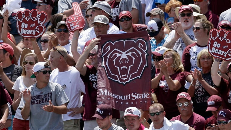 Fans hold Missouri State flags during a tournament in Fayetteville,...