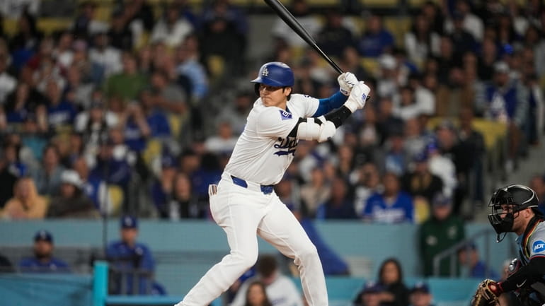 Los Angeles Dodgers designated hitter Shohei Ohtani waits for a...