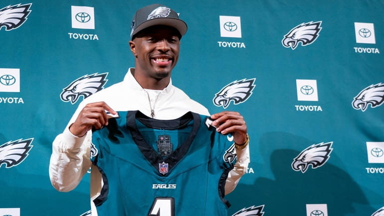 Philadelphia Eagles first round draft pick Quinyon Mitchell holds up...