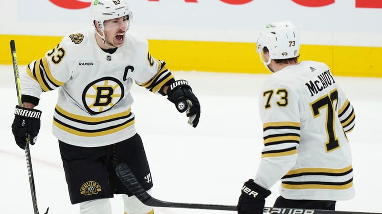 Boston Bruins' Brad Marchand (63) celebrates after his goal against...