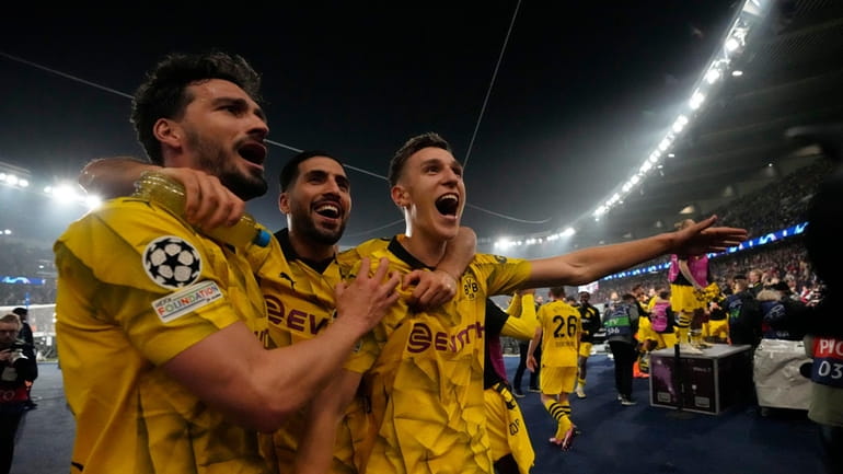 Borussia Dortmund players celebrate at the end of the Champions...