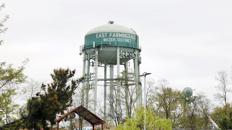 A water tower in East Farmingdale, where water district customers...