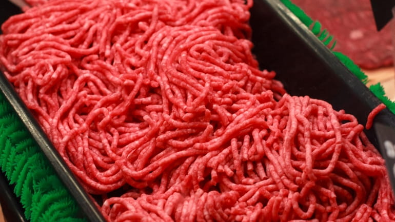 Ground beef is displayed for sale at a market in...