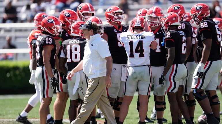 Georgia head coach Kirby Smart walks past the Black Team...