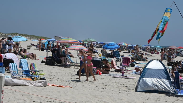 People relaxing and cooling off at Robert Moses State Park...