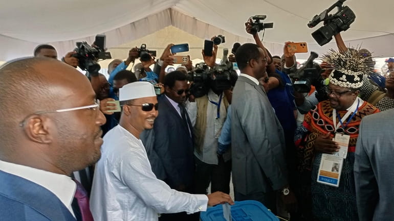 Chadian interim President Mahamat Deby Itno casts his ballot, in...