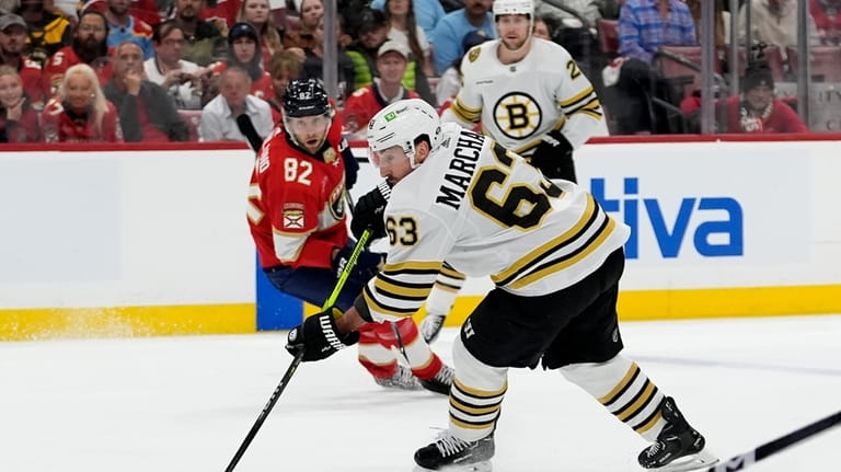 Boston Bruins left wing Brad Marchand (63) skates with the...