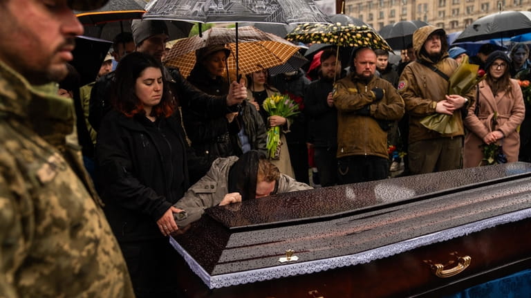 Family, friends and army comrades gather to mourn Ukrainian army...