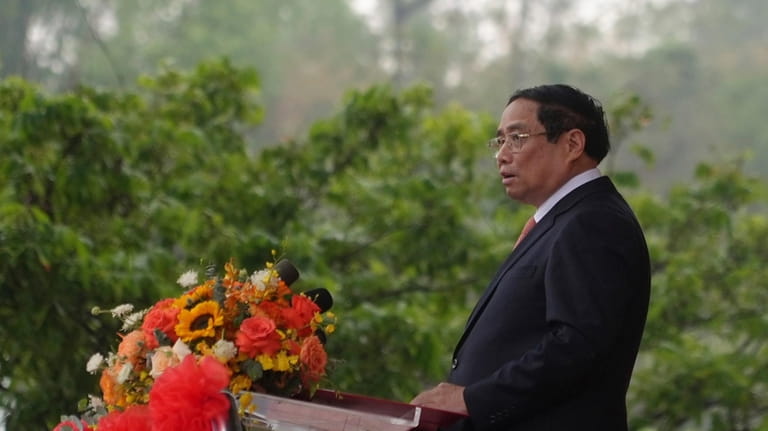 Vietnamese Prime Minister Pham Minh Chinh addresses a gathering at...