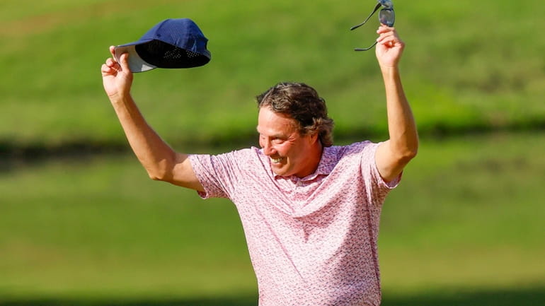 Stephen Ames reacts after making his putt on the 18th...