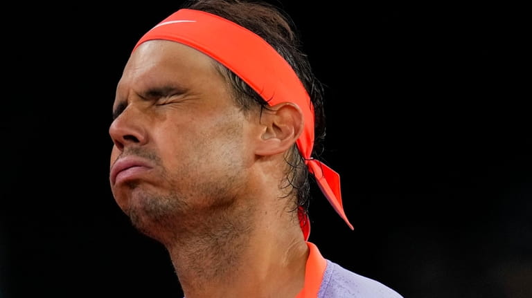 Rafael Nadal, of Spain, reacts during a match against Jiri...