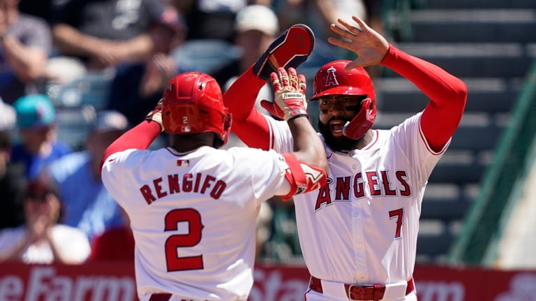 Los Angeles Angels' Luis Rengifo, left, celebrates his two-run home...
