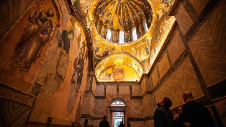 People visit a former Byzantine church which formally opened as...