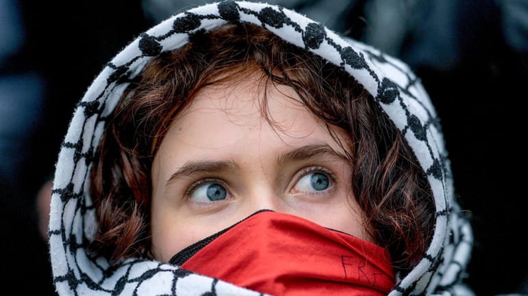 A young woman looks on during a pro-Palestinians demonstration by...