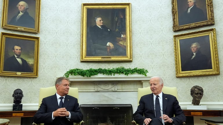President Joe Biden meets with Romania's President Klaus Iohannis in...