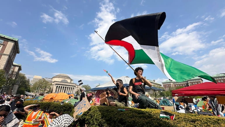 Demonstrators on the Columbia University campus at a pro-Palestinian protest encampment...