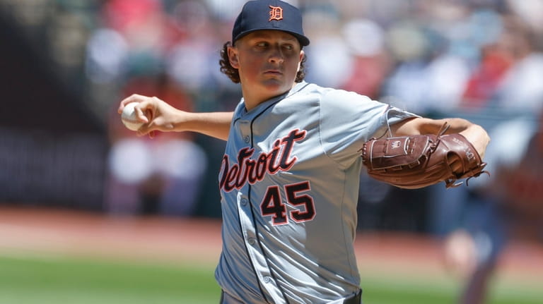 Detroit Tigers pitcher Reese Olson delivers against the Cleveland Guardians...