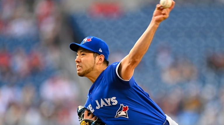 Toronto Blue Jays staring pitcher Yusei Kikuchi throws during the...