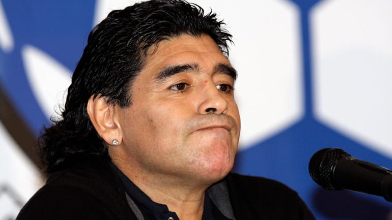 Argentina's national soccer team coach Diego Maradona attends a news...
