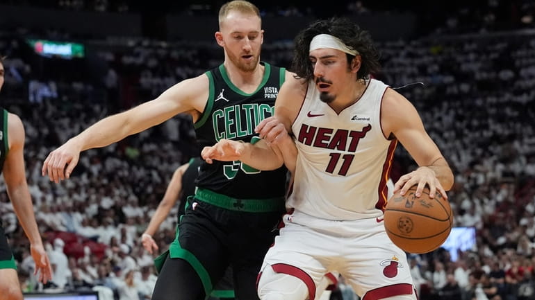 Boston Celtics forward Sam Hauser (30) defends Miami Heat guard...