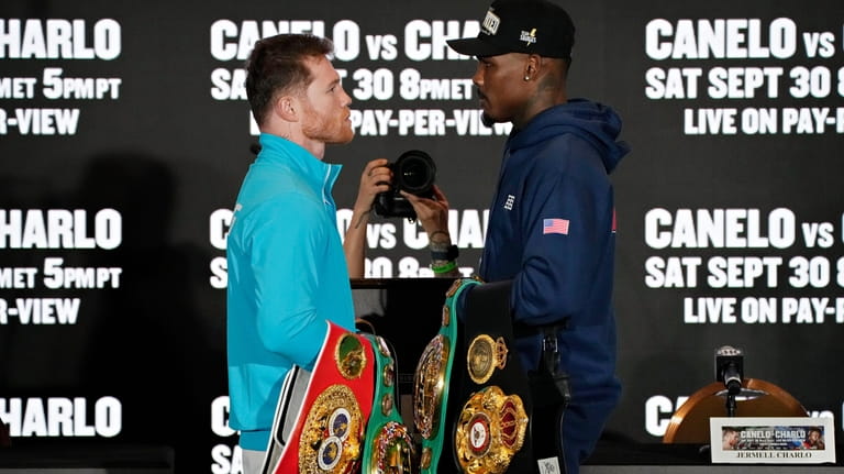 Canelo Alvarez, left, of Mexico, and Jermell Charlo pose during...
