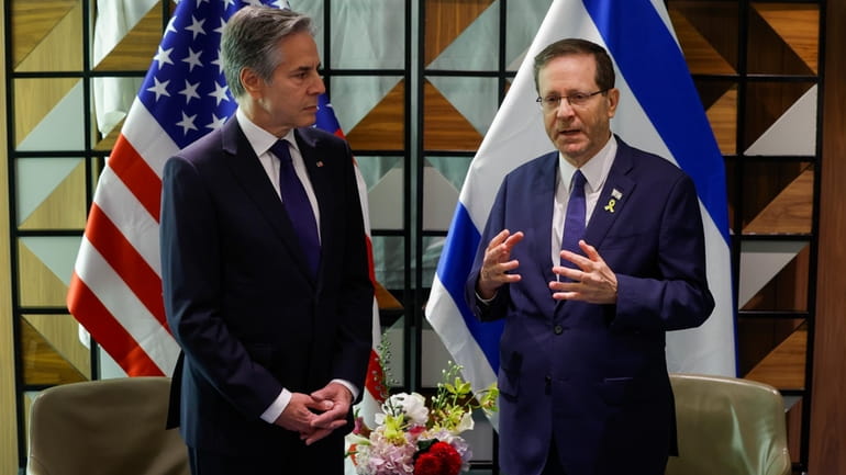 U.S. Secretary of State Antony Blinken, left, and Israeli President...